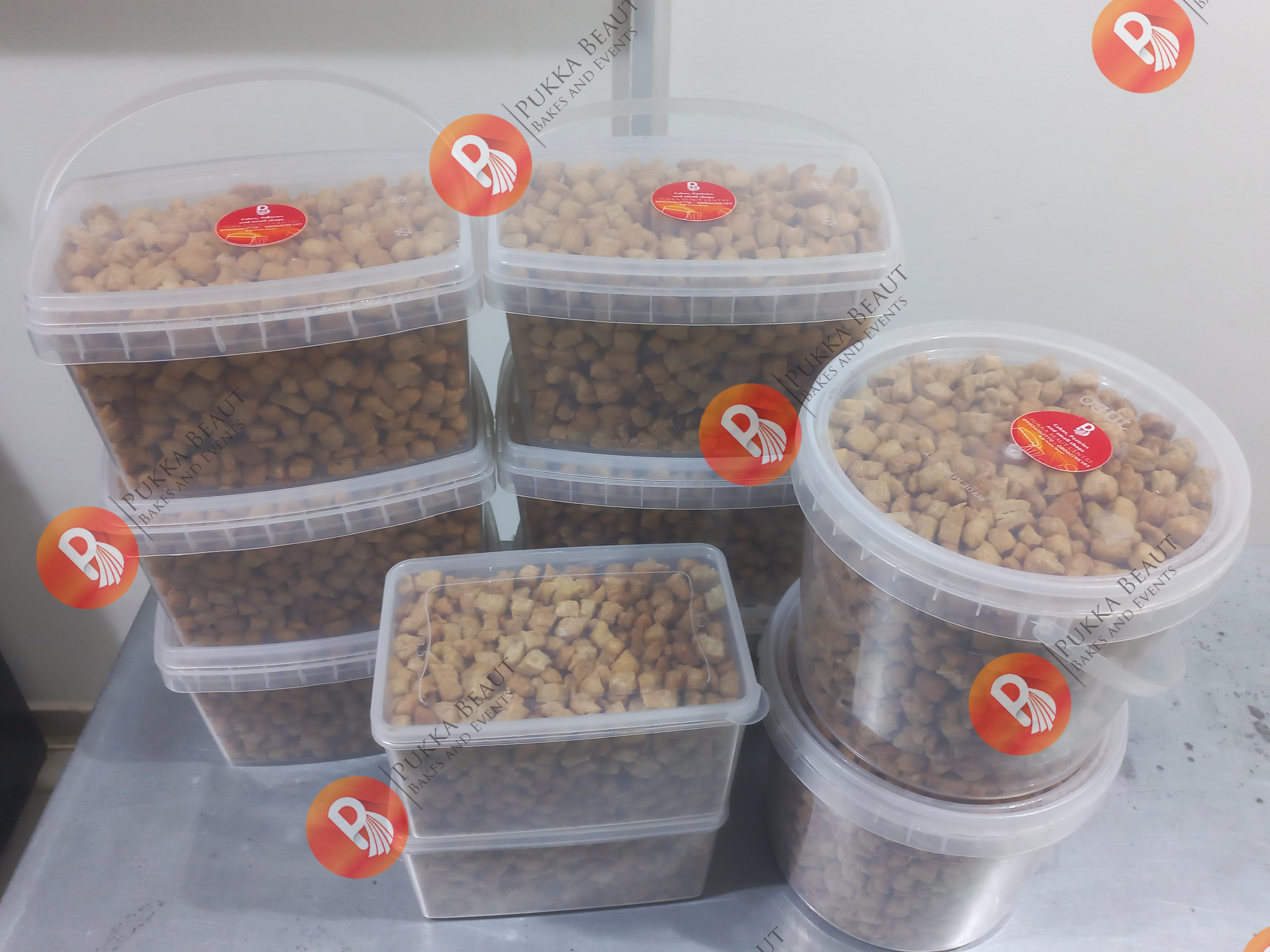 Chin chin in storage tubs baked by Pukka Beaut